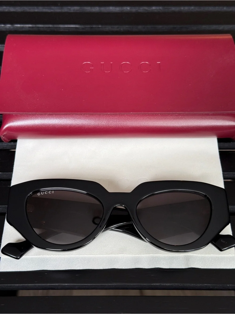 Gucci Black Oval Women's Sunglasses with Dark Lenses